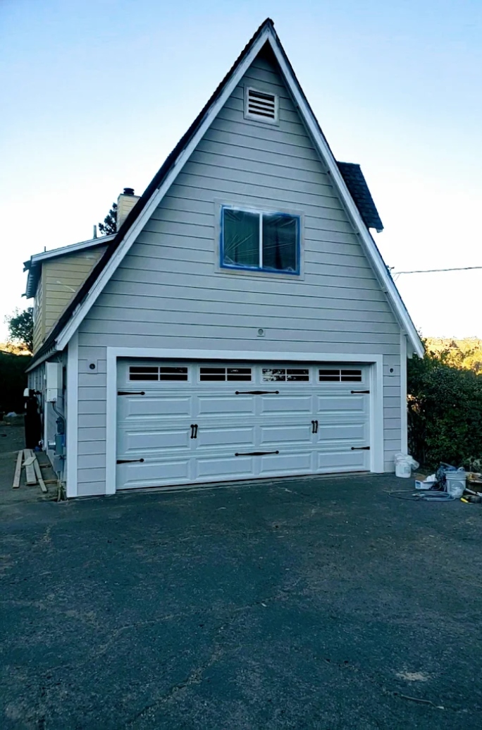 A garage door that won't close being professionally repaired A garage door that won't close being professionally repaired