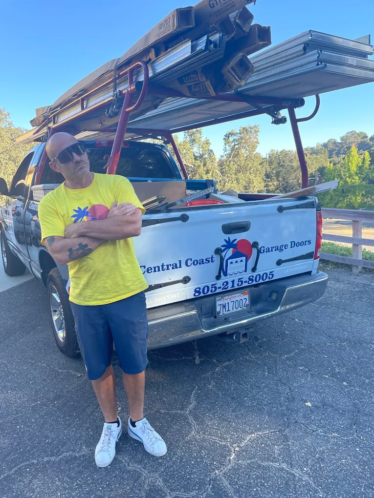 Cory Lewis, Professional technician from Garage Doors 24/7 with branded truck