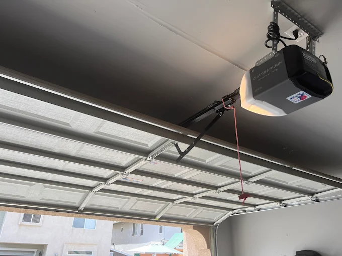Interior view of a high-tech Chamberlain MyQ smart garage door opener installation powered by Wi-Fi technology.